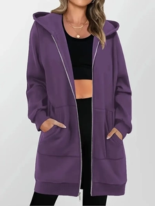 Close-up of purple longline zip-up hoodie featuring large pockets and adjustable hood