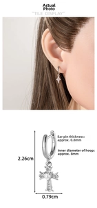 Silver cross earring dimensions: 2.26cm height and 0.79cm width with heart center
