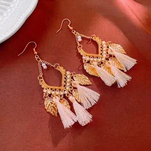 Bohemian vintage long tassel drop earrings with gold filigree and white bead accents