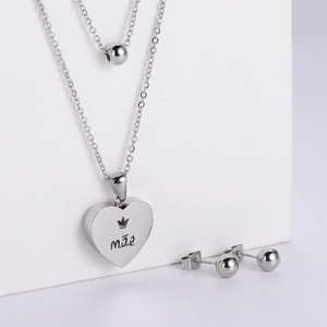 Silver stainless steel jewelry set featuring heart necklace with crown and ball earrings