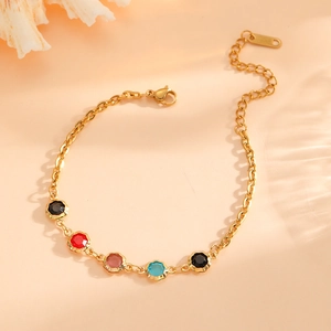 18k gold plated stainless steel bracelet with colorful floral gemstones on pink background