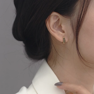 Elegant gold huggie earrings featuring three rows of pave-set black zircon stones