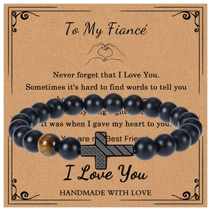 Detail of beaded bracelet with American flag cross and tiger eye stone for fiancé gift