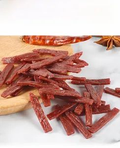 Detailed macro view of realistic PVC dried beef food miniature with spice props