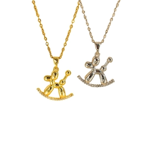 Balloon dog and rocking horse pendants in gold and silver finish with sparkling rhinestones
