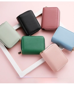 Close-up of litchi grain PU leather mini card holders with golden zippers in six colors