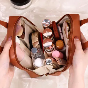 Brown PU leather shell makeup bag with large capacity and multi-layer inner compartments
