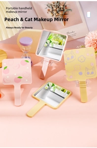 Detail of cute cat and peach printed handheld makeup mirrors with matte plastic handles