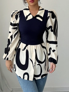 Detail of faux two-piece top featuring navy knit vest and abstract print lantern sleeves