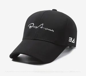 Side view of black cotton baseball cap showing detailed embroidery and curved brim