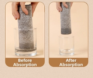 Absorbency test of thick grey microfiber cloth showing water levels before and after
