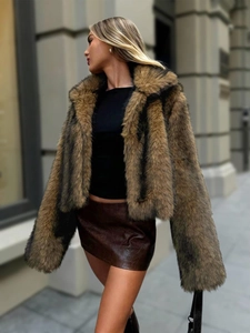 Faux mink fur jacket in brown pattern with faux leather mini skirt in street style