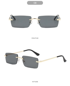 Detail of rimless rectangle sunglasses with gold metal temples and dark grey lenses
