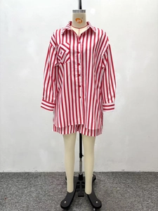 Detail of red and white vertical striped long sleeve shirt with diagonal chest pocket