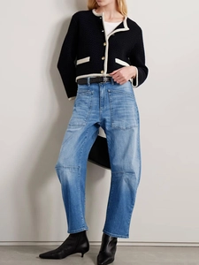 Women's vintage high waist arched jeans with cargo utility pockets in washed blue