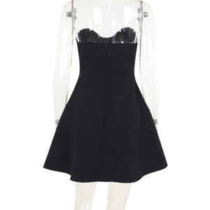 Back view of a black strapless mini dress featuring a concealed zipper and A-line silhouette
