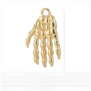 Macro view of a 26x16mm gold stainless steel skeleton hand pendant with gothic details
