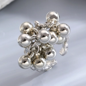 Macro detail of silver cluster ball ring with vintage textured finish for men and women