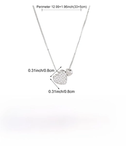 Close-up of double heart pendant necklace with dimensions and material specifications