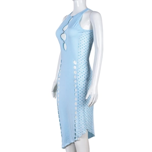 Close-up of light blue sleeveless dress with circular cutouts and polka dot paneling