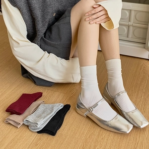 Minimalist combed cotton crew socks for women in multiple solid colors and ribbed texture