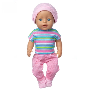 Detail of 43cm doll outfit with pink knitted hat and colorful striped t-shirt and pants