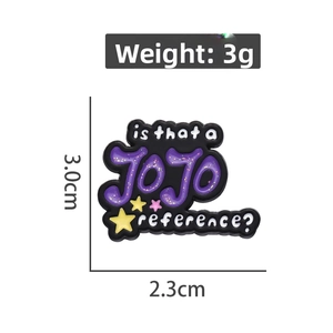 Detail shot of JoJo enamel pin featuring purple glitter lettering and smooth black finish