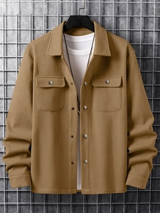 Detail of camel corduroy jacket featuring flap chest pockets and a classic lapel collar
