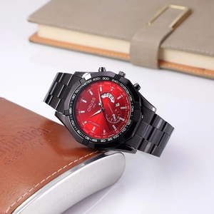Macro detail of red sunray dial chronograph watch on leather flask backdrop