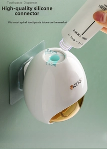 Detail view of the white automatic toothpaste dispenser with a 2.4cm silicone interface