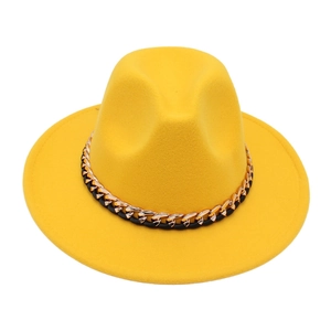 Detail of yellow wool fedora jazz hat featuring a stylish black and gold metallic chain band