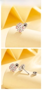 Macro shot of silver flower earrings with pink cubic zirconia and screw back closure