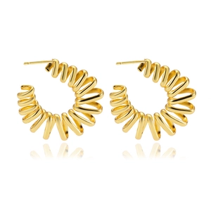 Detail view of golden C-shaped hoop earrings featuring a unique spiral spring structure