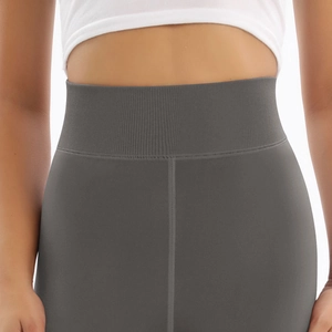 Detail of high-waist charcoal grey fleece leggings with wide ribbed tummy control waistband