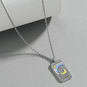 Detailed relief of Tarot Lovers pendant with crescent moon and enamel rainbow stars