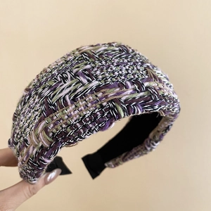 Close-up of three-color tweed texture on French style padded headband in purple and green