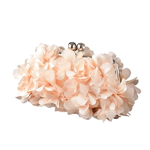 Elegant evening clutch bag with light pink fabric floral petals and metal frame clasp