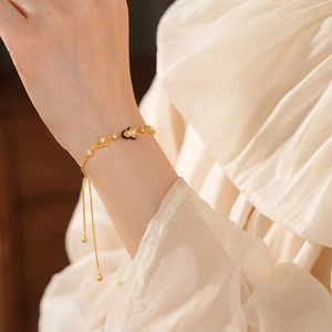 Elegant 18K gold plated pearl bracelet with black heart charm and sparkling zircon stones