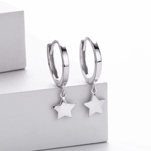 Close-up of polished S925 sterling silver hoop earrings with dangling star pendants