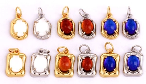 Macro view of assorted copper micro-pave zircon pendants in oval and rectangular shapes