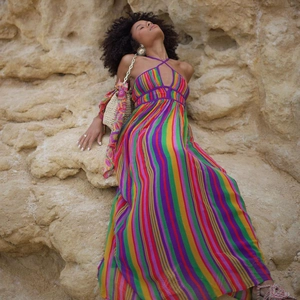 Detail of colorful vertical striped maxi dress with V-neckline and lightweight fabric texture