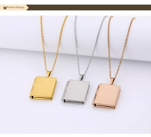 Detailed close-up of book-shaped heart locket necklaces in gold, silver and rose gold colors