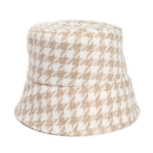 Detail of woven houndstooth pattern texture on stylish winter bucket hat for women