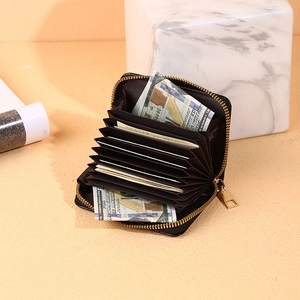 Black crocodile pattern accordion card holder with multiple slots and zipper closure