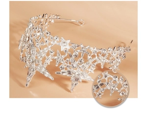 Detailed macro view of sparkling star rhinestones on luxurious bridal tiara crown