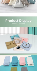 Detailed view of assorted velvet jewelry pouches with snap buttons and drawstring closures