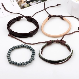 Handmade multilayer leather bracelet set with woven ropes and wooden beads in brown