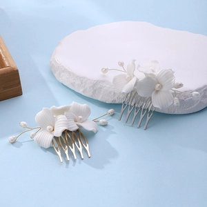 Handmade magnolia ceramic flower hair comb with white pearls for elegant bridal hair styling