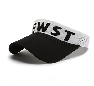 Detailed texture of knit sun visor hat with black and white EWST logo branding