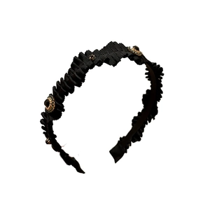 Elegant black pleated headband with vintage dark gemstones and gold metal settings